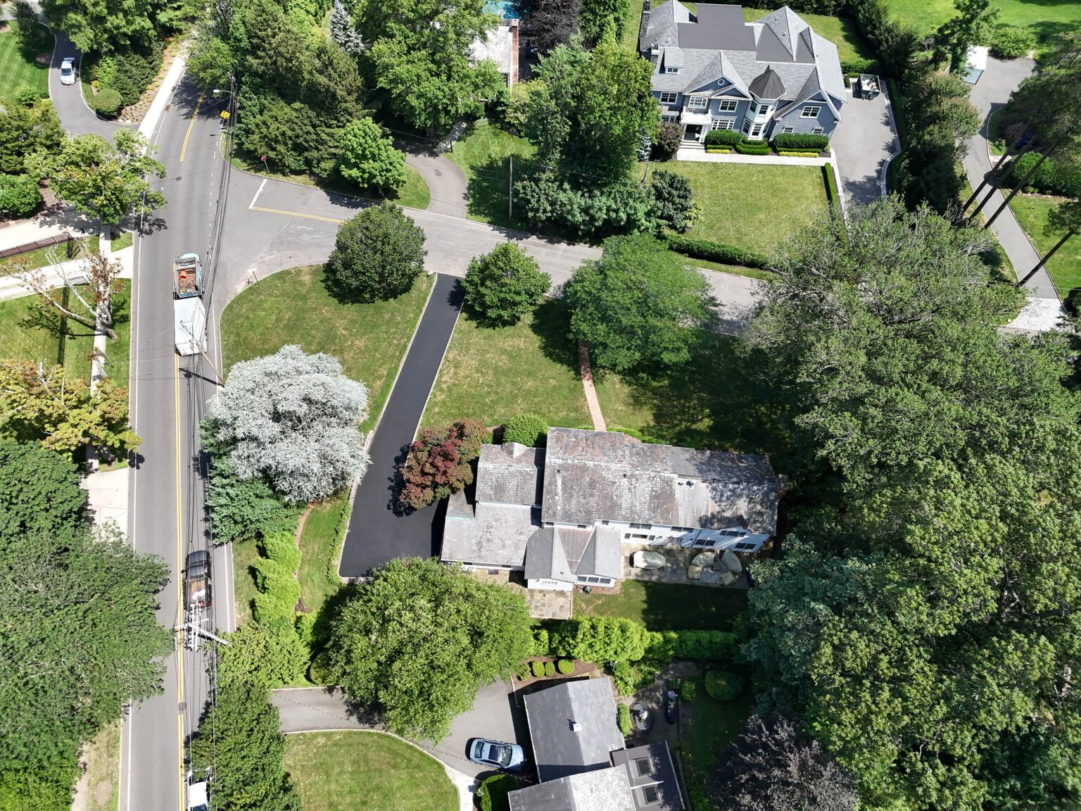 Aerial view of a custom paver patio and hardscape installation by Lou Porchetta Paving